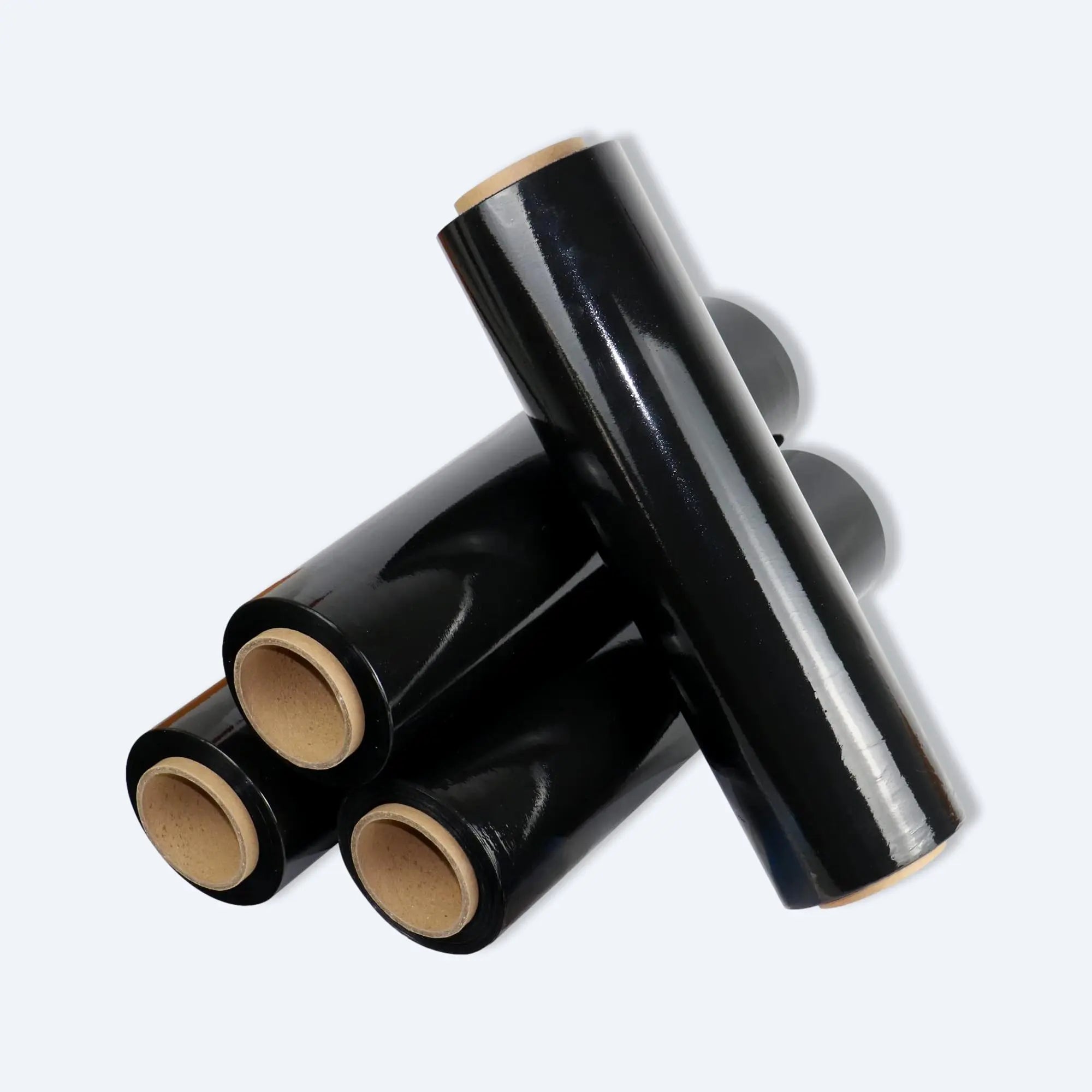 Three glossy black stretch film rolls stacked, showing core tubes