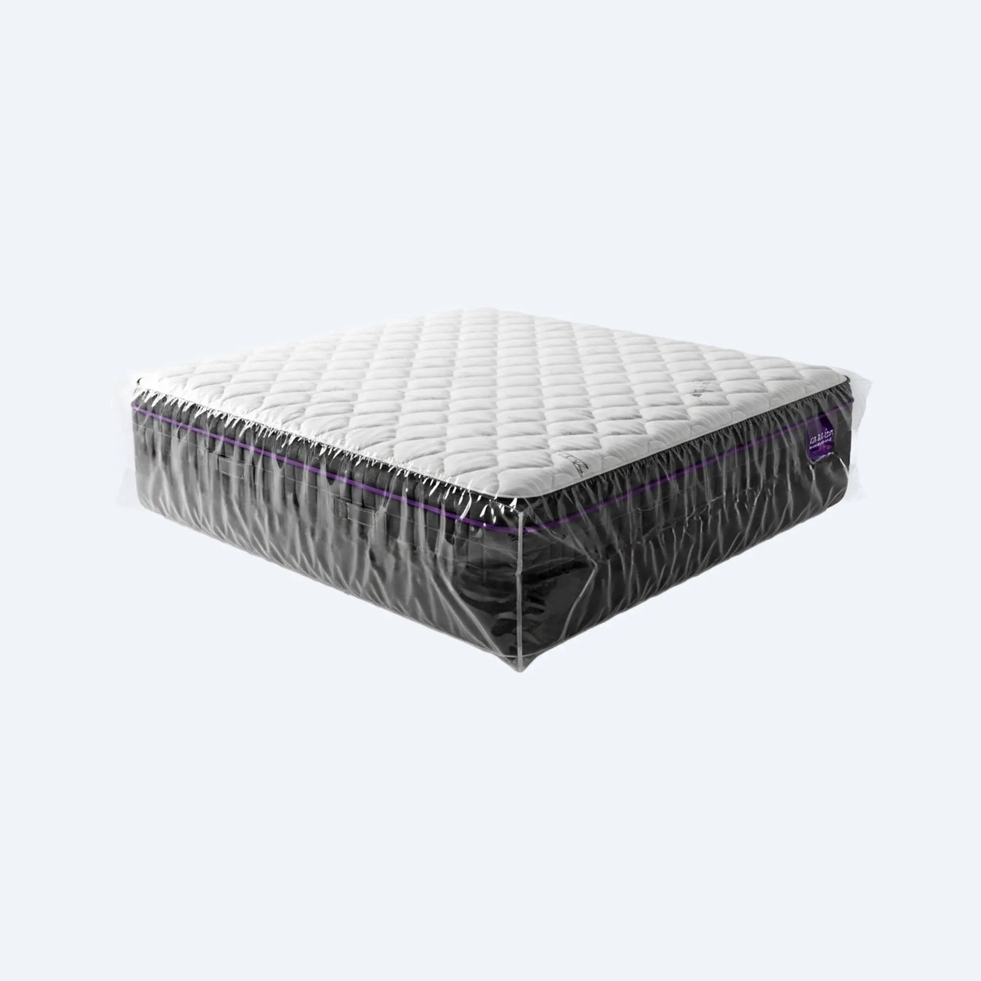 Full queen‑size mattress fully wrapped in a giant clear plastic storage bag, showcasing complete dust‑free coverage.