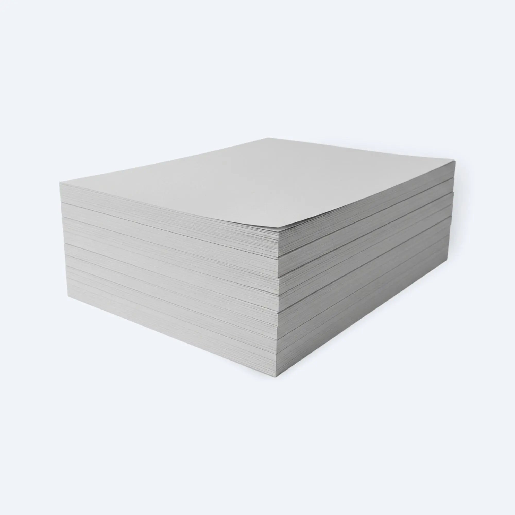 Angled view of a thick stack of blank newsprint packing paper sheets for cushioning fragile items.