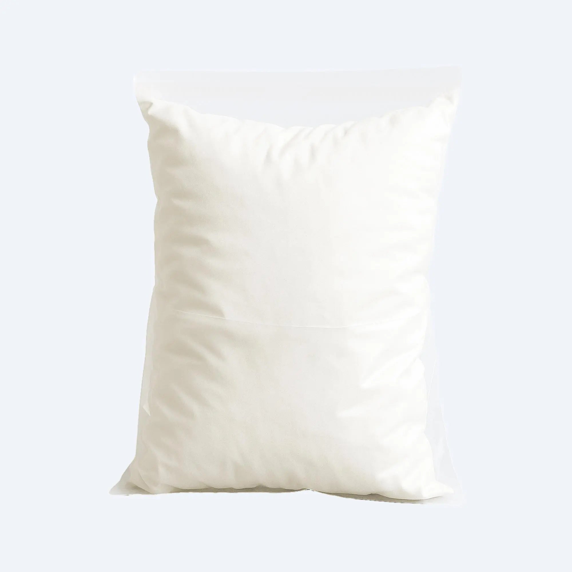 White pillow loosely packed inside a transparent PE flat bag showing open top and wrinkle‑free clarity.