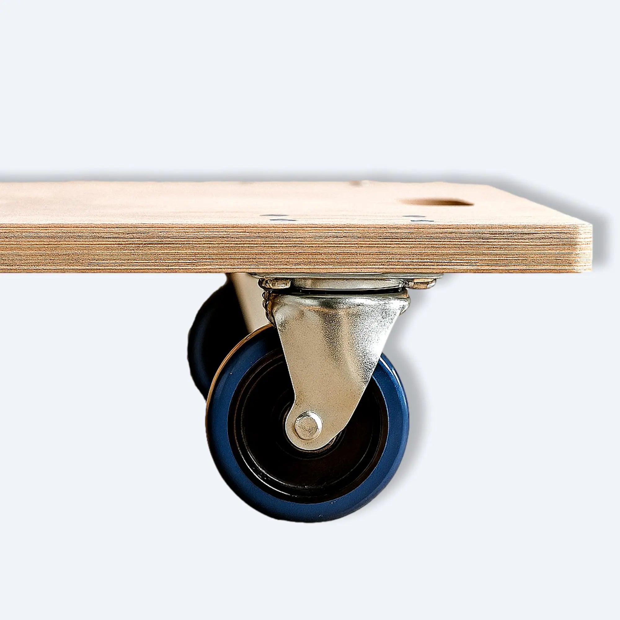 Close‑up of silent blue polyurethane caster wheel on wooden dolly cart, highlighting low‑noise glide