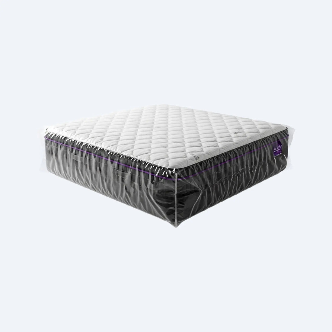 Full queen‑size mattress fully wrapped in a giant clear plastic storage bag, showcasing complete dust‑free coverage.