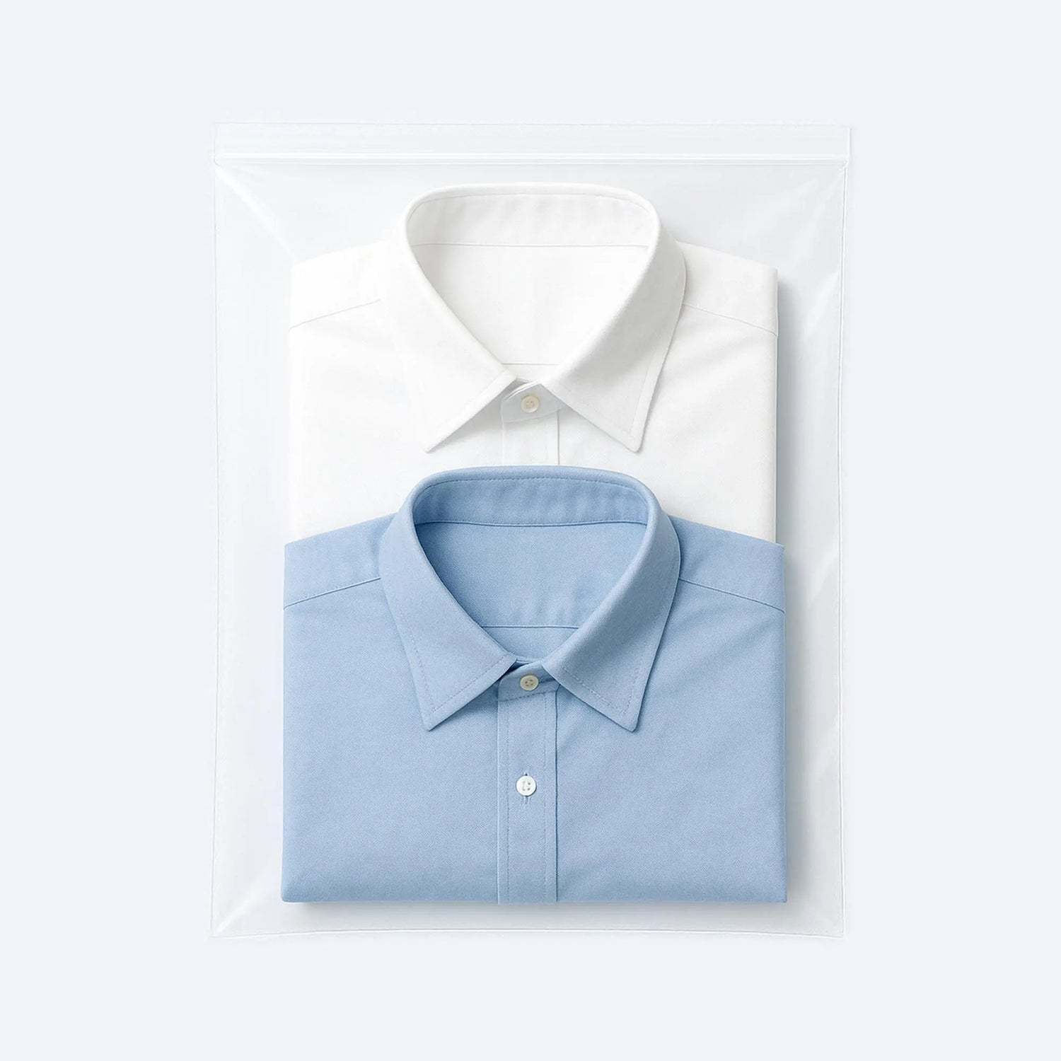 Two folded dress shirts packed inside a large resealable clear ziplock bag, ideal for dust‑free, moisture‑safe garment storage.