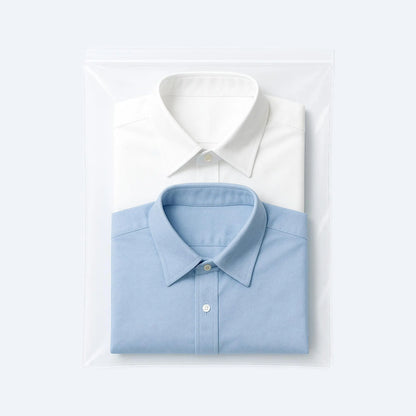 Two folded dress shirts packed inside a large resealable clear ziplock bag, ideal for dust‑free, moisture‑safe garment storage.